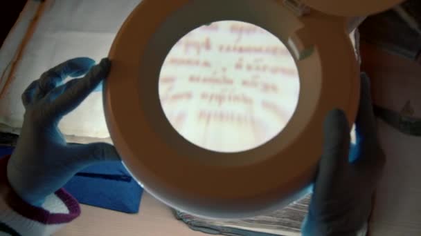Deciphering Old Slavonic Language Stock Footage Huge Magnifying Glass Experts — Stock Video