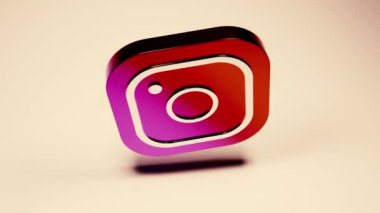 Gri-turuncu arka plan. Tasarım. Facebook ve Instagram simgeleri bilgisayar grafiklerinde oluşturulmuştur. Bir daire içinde dönerler. Sadece başyazı için kullan. Yüksek kalite 4k görüntü