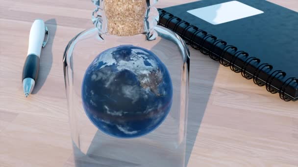 ガラス瓶の中の地球を回転させる デザイン テーブル ノート ペンの惑星の実在的なイラスト — ストック動画