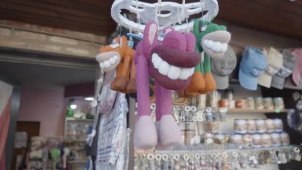 Inexpensive Market Souvenirs Action Displayed Products Caps Toy Big Teeth — Stock Video