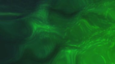 Renkli boya karışımı yavaşça yayılıyor. Hareket. Dalgalı parlak sıvı dokusu