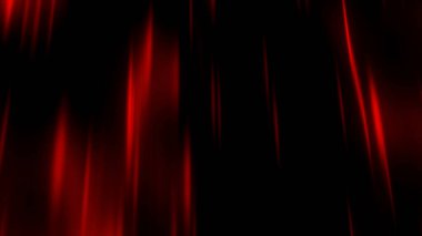 Dark background. Motion. Thin beams of red in the animation scatter slowly in different directions through the darkness. High quality 4k footage clipart