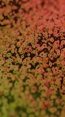 Bu canlı, soyut doku, benekli bir efektle geliştirilmiş yeşil ve kırmızı tonların büyüleyici bir karışımını sergiliyor.