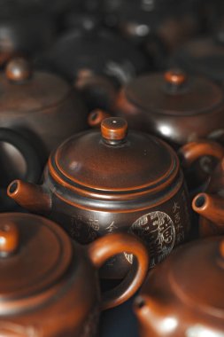 An exquisite array of traditional teapots showcasing exceptional craftsmanship and intricate designs clipart