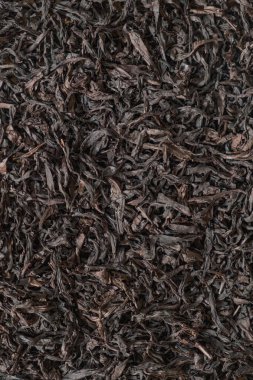 These highquality dried black tea leaves are perfect for brewing delicious, flavorful tea that delights the senses clipart