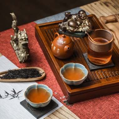 A beautifully serene tea ceremony setup showcasing elegant teaware, fragrant tea, and various decorative elements clipart