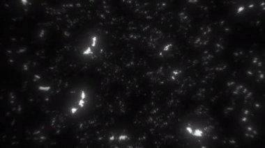 Siyah arka planda dağınık ışık lekeleri olan, derinlik ve boyut çağrıştıran ilgi çekici soyut bir kompozisyon.