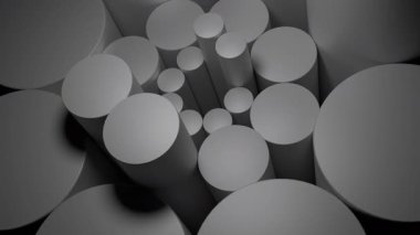 Gri silindirlerin soyut animasyonu döner ve koyu gri arka planda desenler yaratır. Tasarım