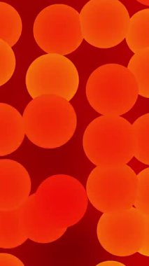 Bu canlı video kırmızı arka planda renkli daireler gösteriyor. Büyüleyici turuncu ve sarı daireler enerjik ve sıcak bir görsel deneyim yaratıyor.