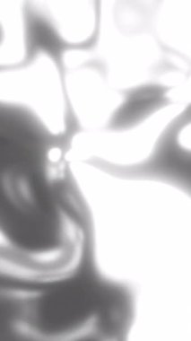 Büyüleyici soyut bir arka plan güzel bir şekilde sergilenen sıvı gümüş şekiller ve büyüleyici hareketler