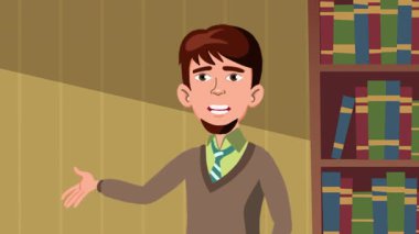 Animasyon profesörü kitaplığın yanında bir şey sunuyor ya da açıklıyor.