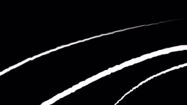 Birden fazla beyaz iz büyüyor ve siyah bir arkaplanı geçiyor.