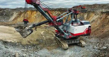 Powerful excavator working in a quarry, extracting minerals