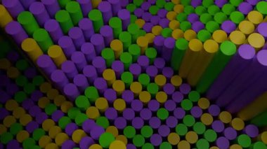 Mor, yeşil ve altın renkli silindirlerin soyut animasyonu bir desen gibi hareket ediyor.