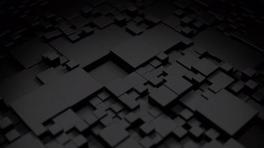 Siyah küplerin düzgün hareket etmesi soyut ve büyüleyici bir görüntü yaratır.