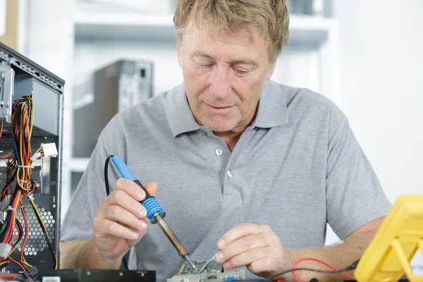 Man Soldering Iron Repairs Computer Equipment — Stock Photo, Image