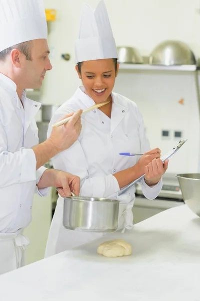 Chef Holding Wooden Spoon Colleague Taste Food — Stock Photo, Image