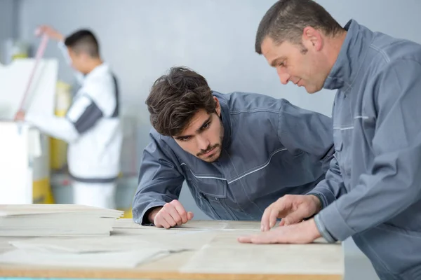 Young Male Decorator Watching Supervisor Demonstrating Technique — Stock Photo, Image