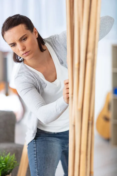 Woman Reorganizing Furniture Home — Stock Photo, Image