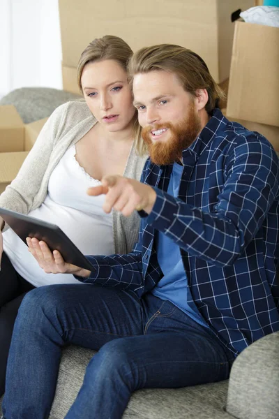 Attractive Happy Young Man Pregnant Woman Holding Digital Tablet — Fotografia de Stock