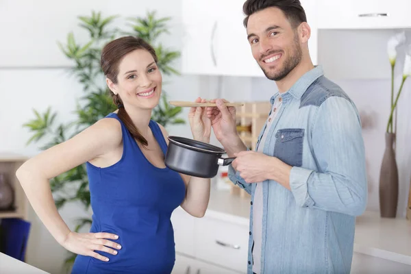 Young Smiling Man Feeds His Pregnant Wife Cookies Breakfast — Stock Photo, Image