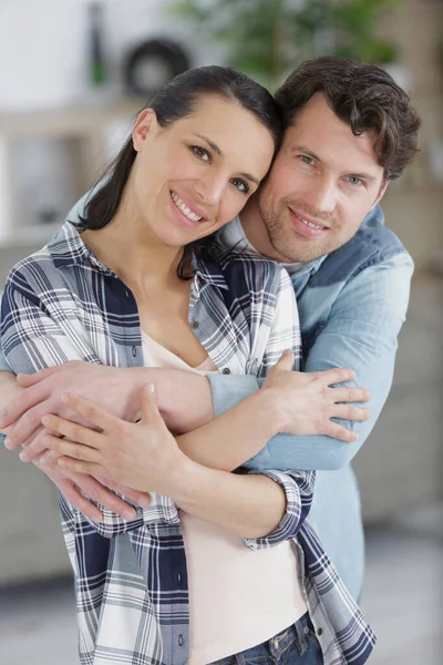 Man Hug His Girlfriend Standing Home — Stock Photo, Image
