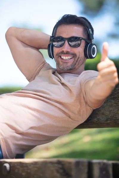 Young Man Sitting Bench Listening Music — Stock Photo, Image
