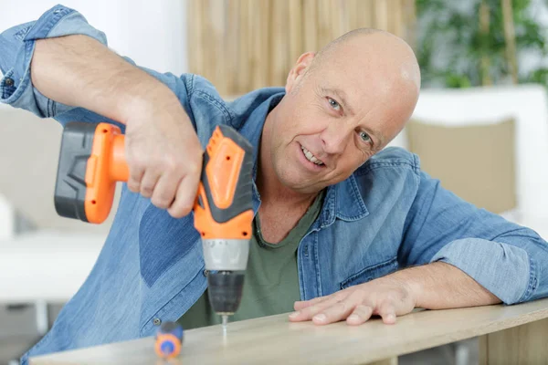 Mature Man Fixing Furniture — Stock Photo, Image