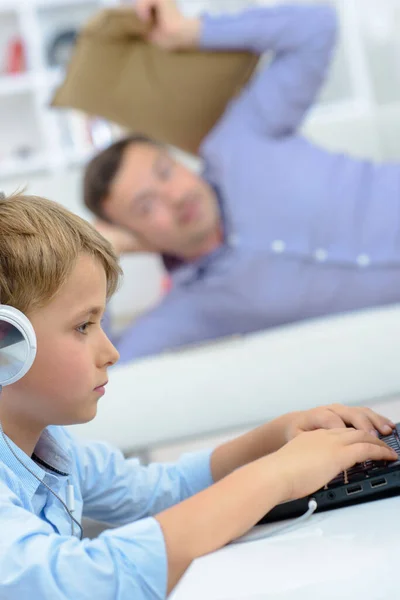 Man Poised Throw Cushion Child Get His Attention Computer — Stock Photo, Image