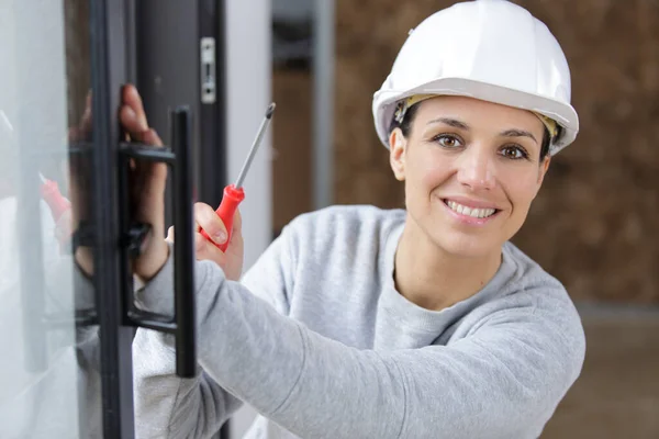 Woman Worker Screwing Window — Stock Photo, Image