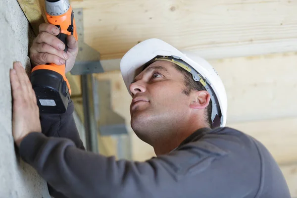 Male Worker Drilling Hole Ceiling — Stock Photo, Image