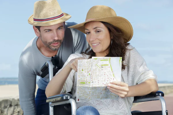 Handicapped Woman Wheelchair Husband Checking Map — Stock Photo, Image