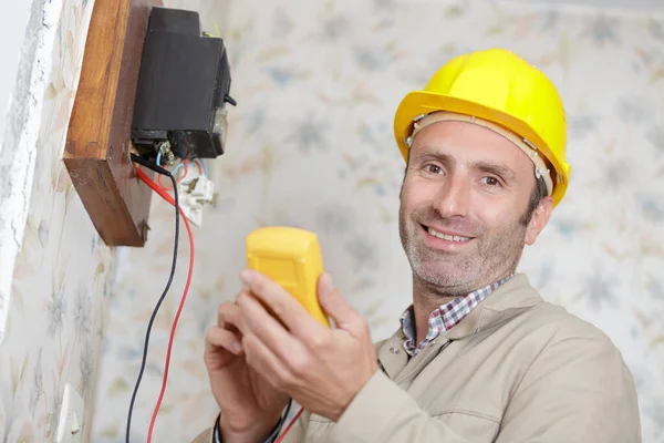 Happy Builder Measuring Voltage — Stock Photo, Image