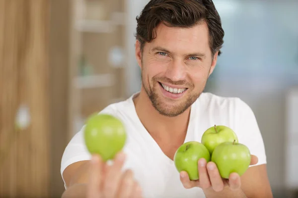 Young Man Holding Green Apples — Stock Photo, Image