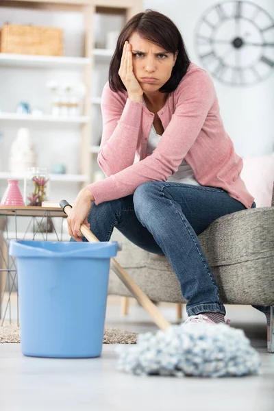 Frustrated Woman Sits Sofa Mop Bucket — Stock Photo, Image