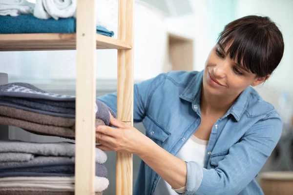 Woman Tidying Clean Laundry Home — Stock Photo, Image