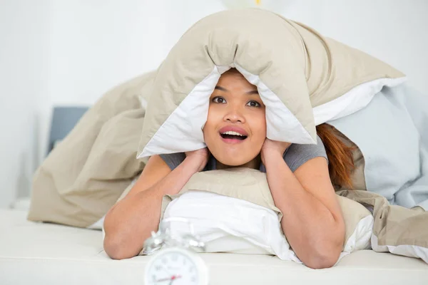 Lady Covering Ears Pillow Noise Alarm Clock — Stock Photo, Image