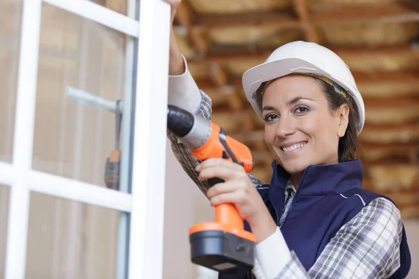 Woman Builder Drilling Window — Stock Photo, Image