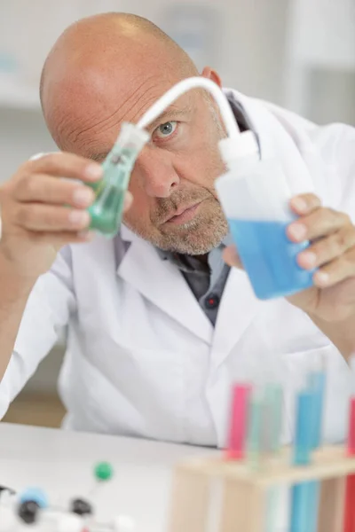 Male Scientist Carefully Adding Solution Small Glass Flask — Stock Photo, Image