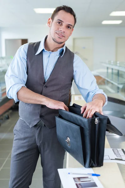 Happy Young Businessman Opening Leather Folder — Stock Photo, Image