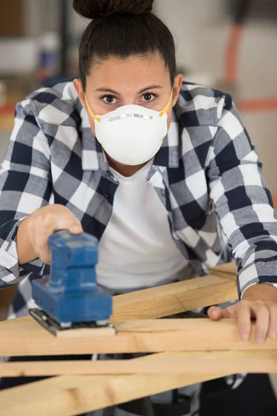 Young Carpenter Wearing Filter Mask Sanding Wooden Work Piece — Stock Photo, Image