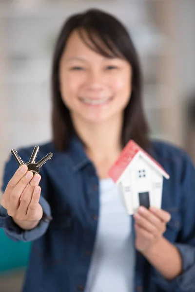 Young Casual Woman Holding House Key Model — Stock Photo, Image