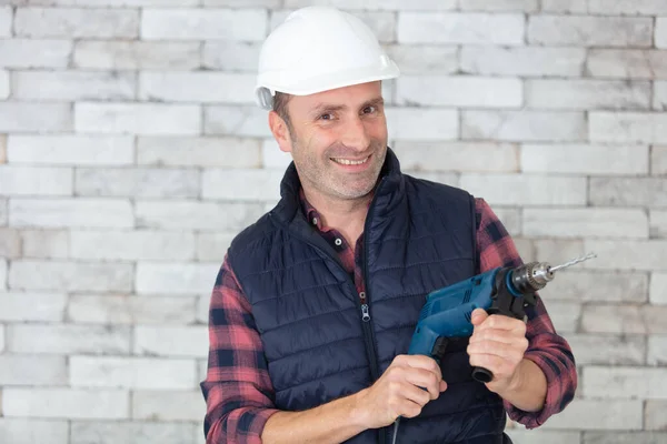 Handsome Builder Uniform Tool Belt Holding Drill — Stock Photo, Image