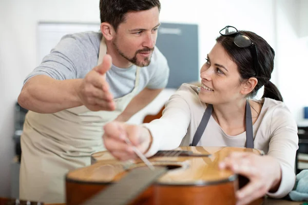 Male Female Repairing Guitar Together Home — Stock Photo, Image