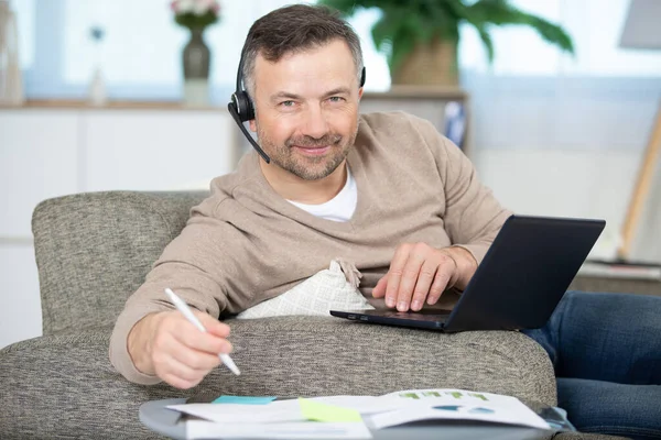 Man Home Working Laptop Wearing Headset — Stock Photo, Image