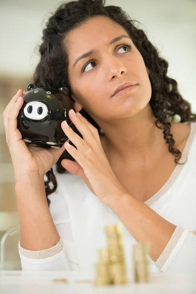 Sad Woman Shaking Piggy Bank Home — Stock Photo, Image