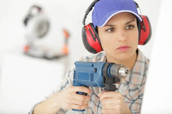 Attractive Builder Woman Drill Her Hands — Stock Photo, Image