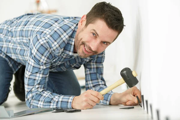 Handyman Installing Wooden Floor — Stock Photo, Image