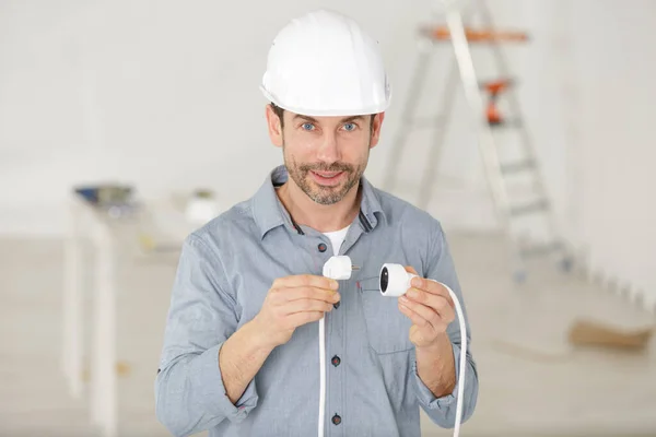 Man Holding Cable Plugs — Stock Photo, Image