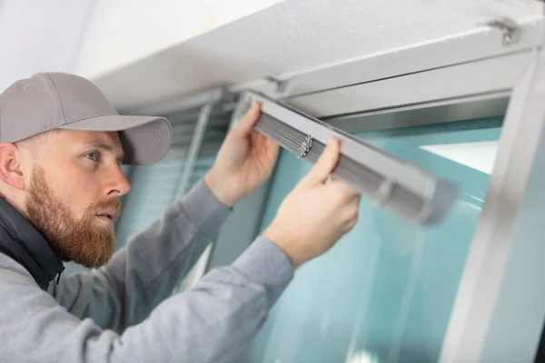 Young Man Installing Window Blinds Home — Stock Photo, Image